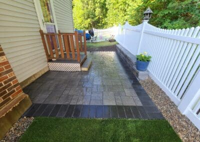 Small patio with concrete entrance and artificial grass - hardscapes amherst nh