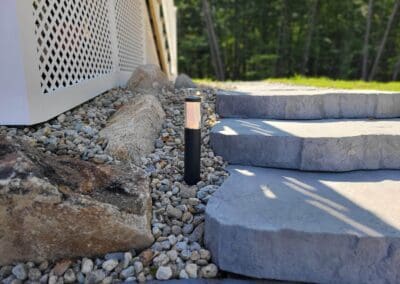 Outdoor lamp beside stone stairs - landscape designers near me