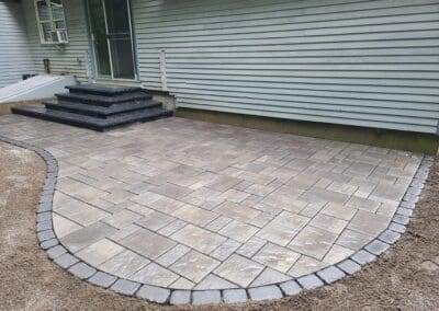 Concrete patio floor outside entrance by Modena NH - hardscapes merrimack nh