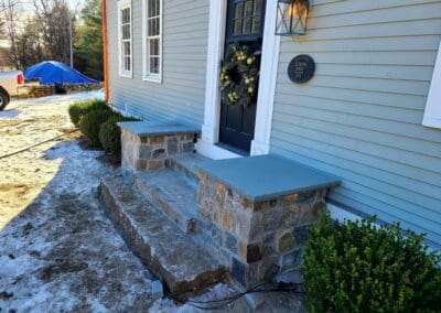 Masonry steps and pillars outside a house - hardscapes brookline nh