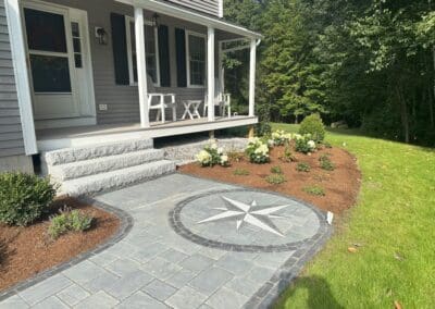 Concrete walkway with decorative compass by Modena NH - hardscapes hollis nh