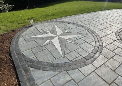 Decorative compass in concrete walkway - hardscapes amherst nh