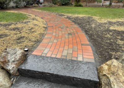 Brick walkway with concrete steps made by Modena NH - hardscapes auburn nh
