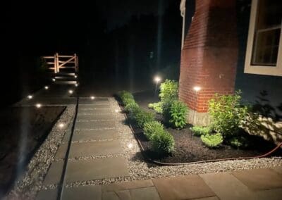 Illuminated walkway by Modena NH - landscape designers near me